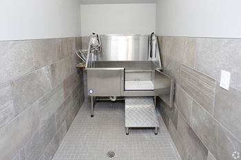 a large stainless steel sink in a commercial kitchen at Mezzo Apartments, North Dakota